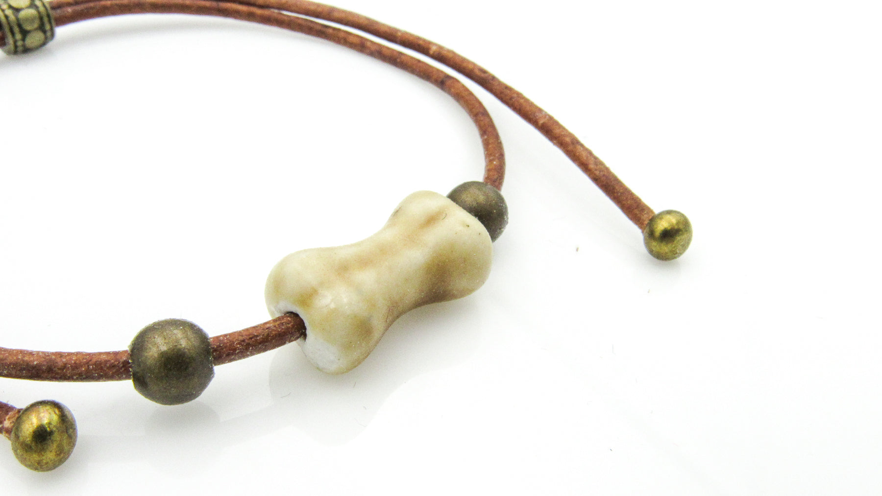 Bone Shape Ceramic Bead On Leather Cord Adjustable Slide Bracelet